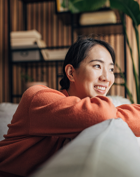 Woman smiling, representing diverse patient communities